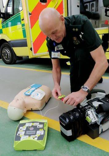 Paramedic using defib