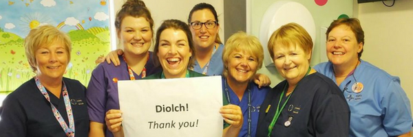 Picture of nursing staff holding up a thank you banner